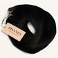 A bundle of black hair extensions with a beige paper tag reading PHANES, photographed on a clean white background. (Jet Black / #1)