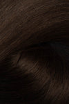 A close-up texture shot of dark brown hair, showing the fine strands and subtle sheen. (Soft Black / #1b)