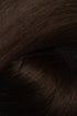 A close-up texture shot of dark brown hair, showing the fine strands and subtle sheen. (Soft Black / 