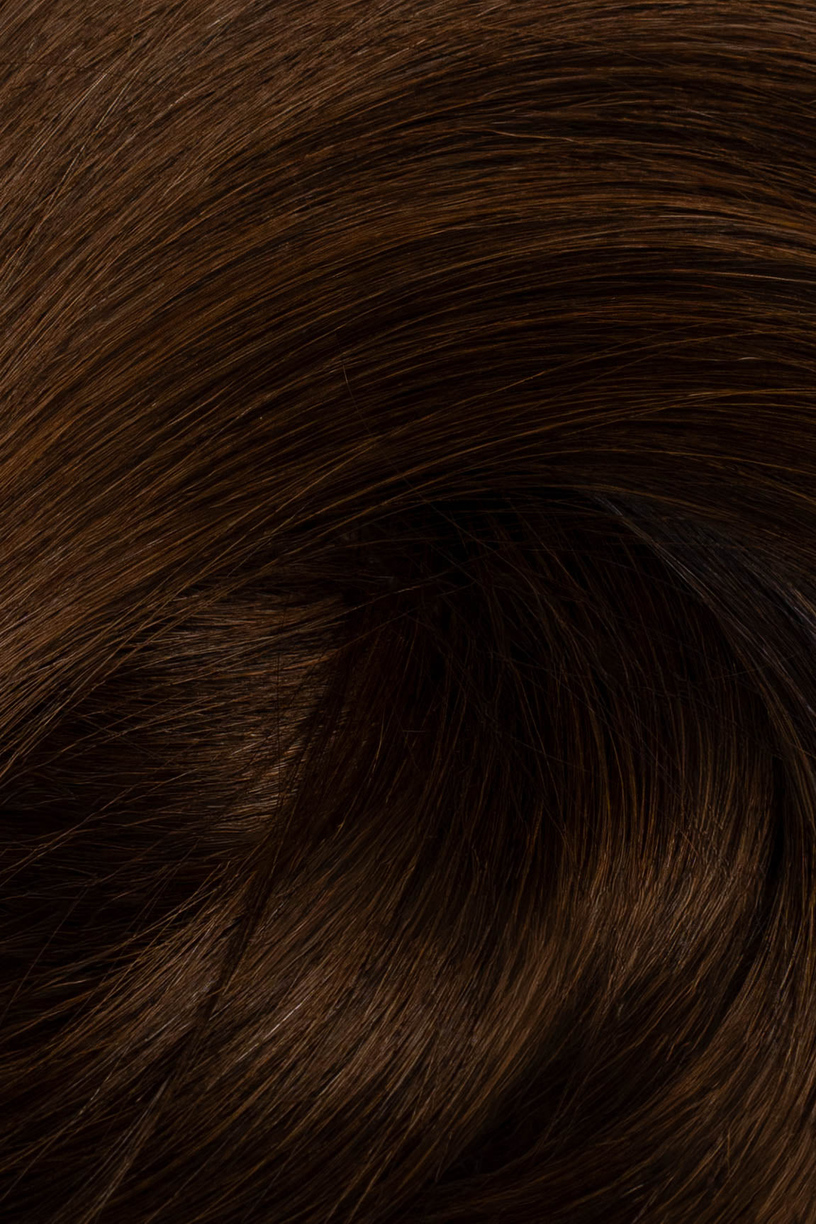 A close-up texture shot of dark brown hair with subtle warm brown highlights, showing the fine hair strands and glossy sheen. (Dark Brown / #2)