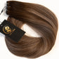 A bundle of brown hair extensions with a black brand tag attached, displayed on a clean white background. (Mushroom Brown / B2/9.1)