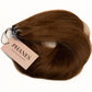 A bundle of medium brown hair extensions with a beige paper tag reading PHANES HAIR EXTENSIONS, set against a plain white background. (Brown / #4)