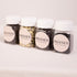 Four jars of Phanes on a light pink background