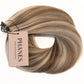 A coiled synthetic hair extension piece with a light pink brand tag reading PHANES HAIR EXTENSIONS, shown on a plain white background. (Ash Piano / FV)