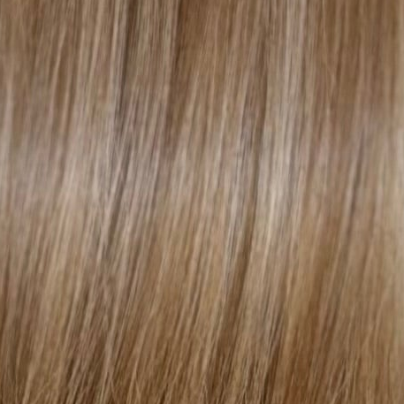 A close-up texture shot of straight hair in a light ash blonde color, showing individual strands and subtle highlights. (Brunette Highlights / #P6/22)