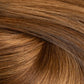 A close-up texture shot of smooth, straight brown hair with warm golden and caramel highlights, arranged in a soft swirl. (Carmel Mocha / TBF)