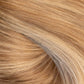 A close-up texture shot of wavy, light golden blonde hair with subtle warm brown and beige undertones. (Brooklyn Balayage / #TFF)