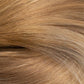 A close-up texture shot of light golden blonde hair with subtle warm brown and beige undertones. (Miami Balayage / TLQ)