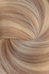 A close-up texture shot of light blonde hair styled in a spiral pattern, showing the fine strands and warm golden-blonde color. (Icy Balayage / 