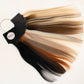 A hair color swatch fan showing multiple blended hair colors including black, brown, blonde, and copper tones, attached to a black ring holder with a visible 'MMS' label, on a plain white background.